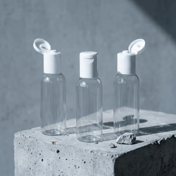 50ml transparent bottle with white flip top cap cosmetic packaging India